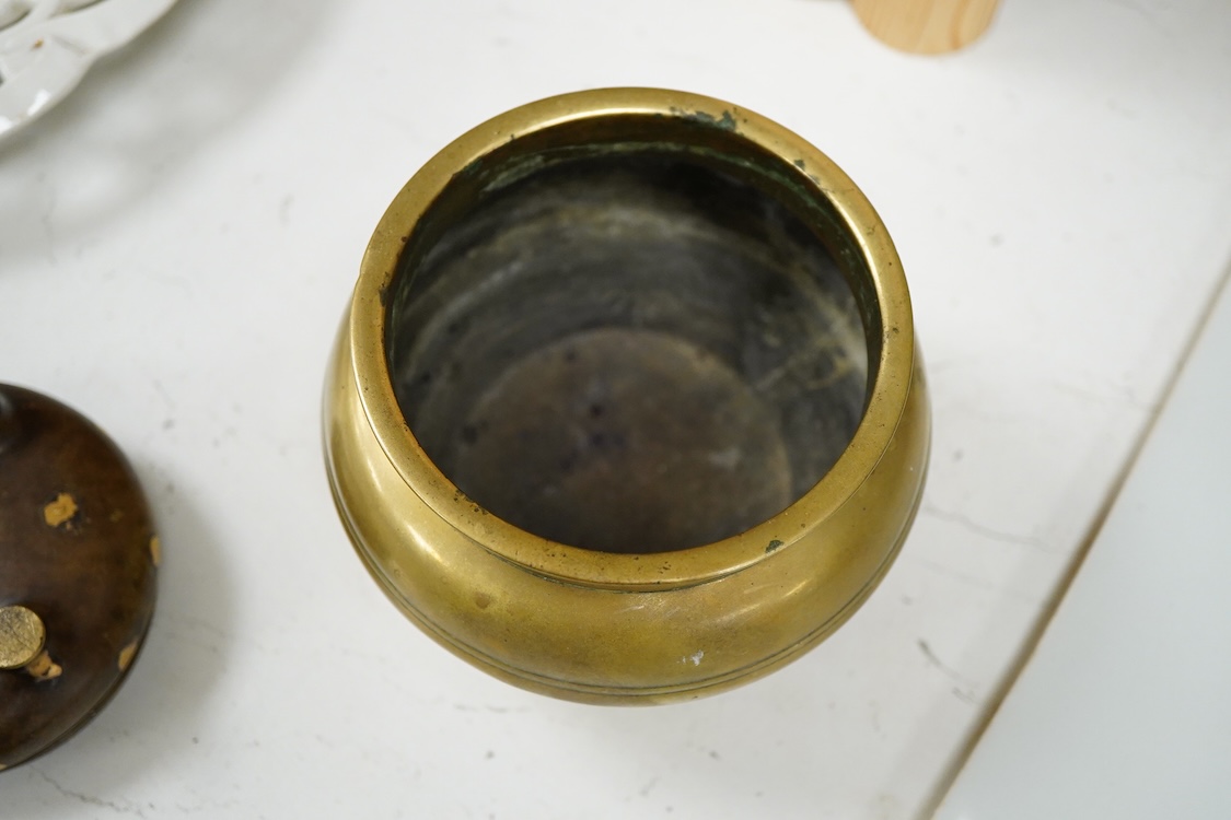 A Chinese bronze censer with gilt splashed decoration, signed with character marks to the base, together with another gilt censer, largest 12cm in diameter